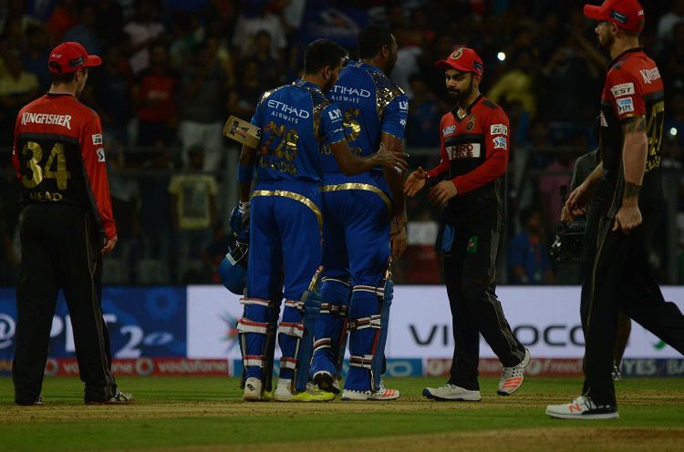 Hd Image for Cricket Mumbai Indians celebrate after winning the IPL match against Royal Challengers 